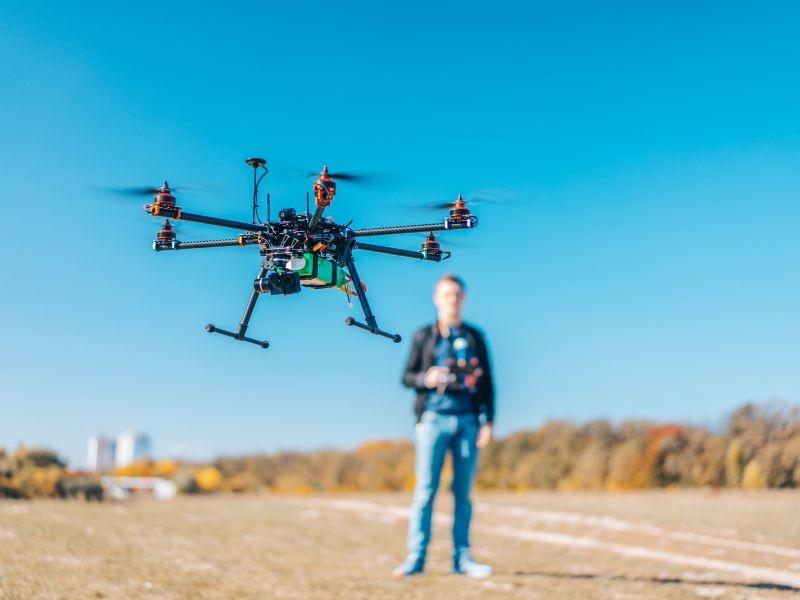 drone pilot standing in front of drone